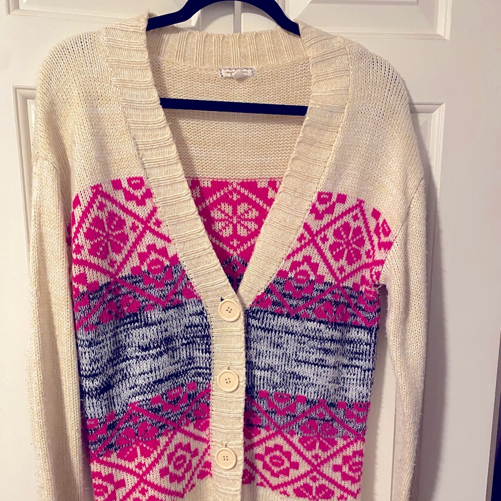 Pink, tan, and black junior’s eyeshadow cardigan is stylish, warm, and versatile